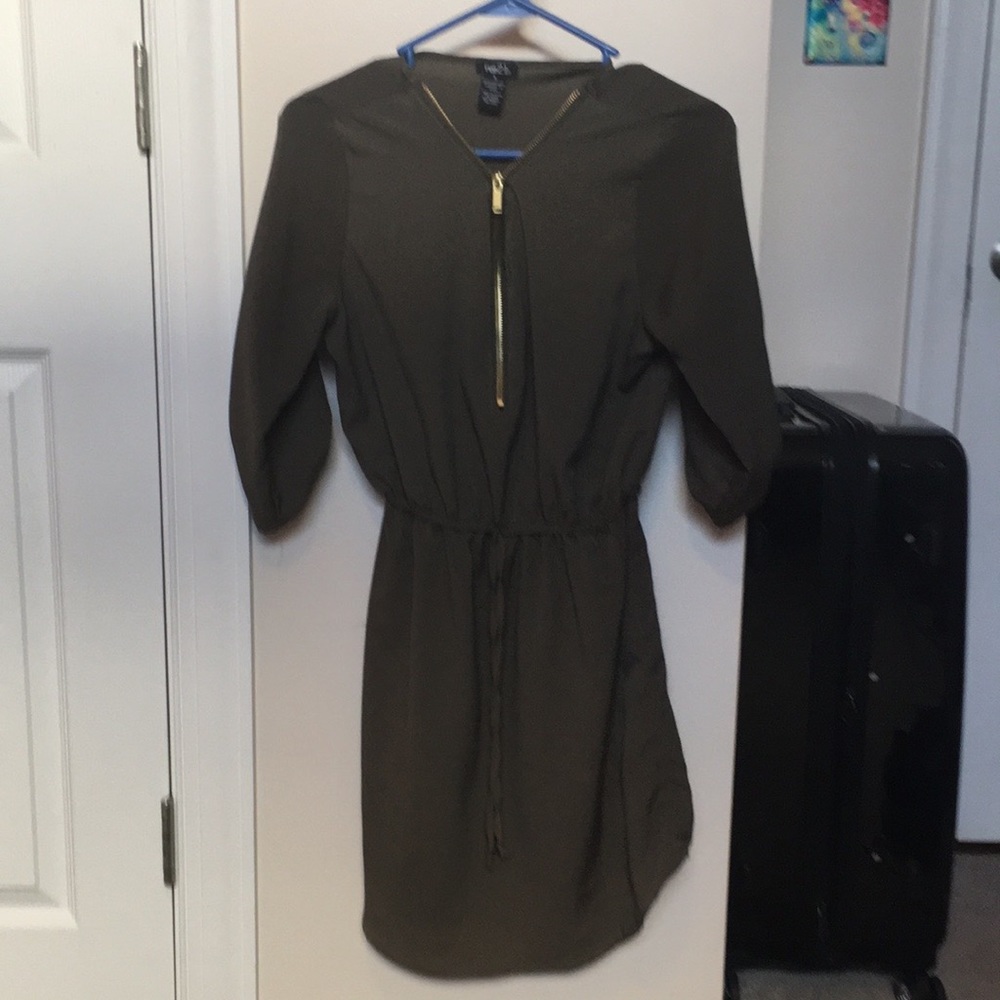 Dark green dress with gold zipper.